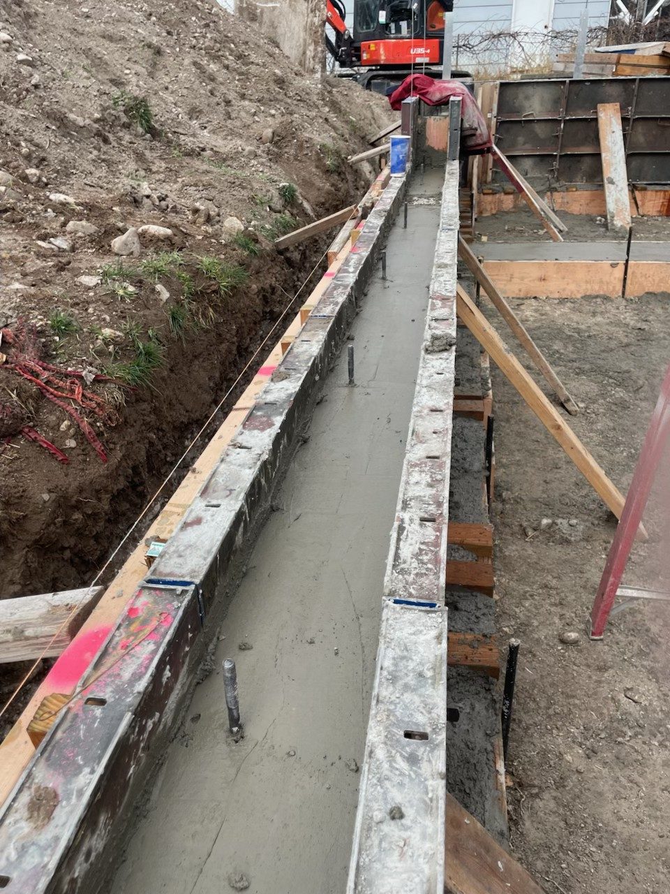 Concrete retaining wall pour by Firm Foundation of Utah in Lehi, UT